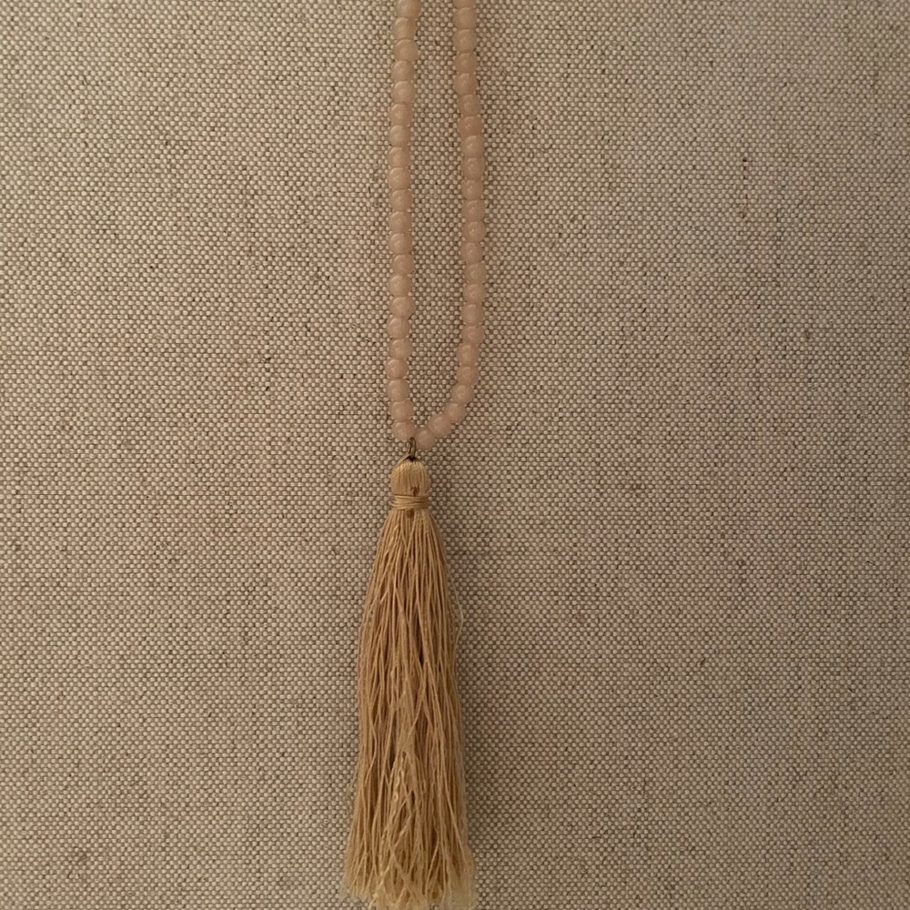 Gold beaded necklace with tassel drop